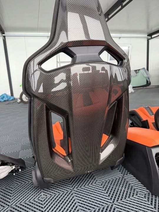 BMW M3 G80 carbon fiber racing seat backrest showing harness pass-through loops — ApexCarbon shop
